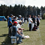 Crowd looks on from sidelines