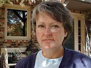 
Lynn Holmstrom of Granite Falls has lived in her home on the edge of the city 24 years. She used to enjoy seeing an occasional deer visit her yard, but now they eat her plants.  (MPR Photo/Mark Steil)