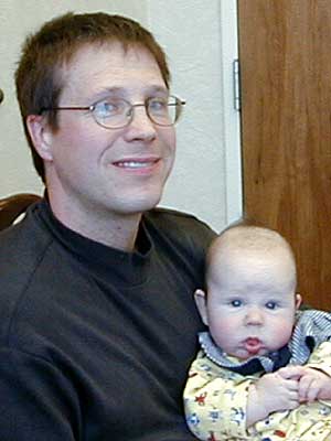
Tad Thorstenson (with son), a teacher at Abraham Lincoln, first reporting the testing irregularities.  (MPR Photo/Tim Pugmire)