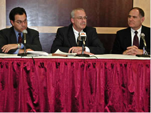 
Appearing at the U of M news conference on the stadium issue were, left to right, Mark Rotenberg, U of M general counsel; Richard Pfutzenreuter, U of M chief financial officers, and  Joel Maturi, U of M athletics director. (MPR Photo/Marisa Helms)