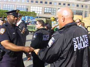 
Just a few weeks after the terrorist attack on New York, Gov. Jesse Ventura signs an autograph for a New York City police officer during a tour of the World Trade Center site. (MPR Photo/Tom Scheck)