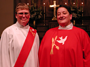 
Johanna Morrigan, left, was ordained as both a deacon and preacher. Cedar Morrigan, right, was ordained as a priest. Both are from Little Falls. (MPR Photo/Jeff Horwich)