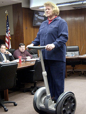 
Molnau, who headed the House Transportation Committee, tries out a Segway Scooter at a hearing during the 2002 legislative session. (Photo courtesy of Minnesota Legislature)