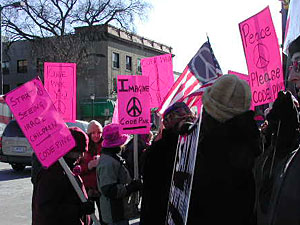 
On a recent bitterly cold Saturday afternoon, more than 2,000 anti-war activists rallied in uptown Minneapolis, to the honks and thumbs-up of many passing motorists.  (MPR Photo/Mary Losure)