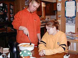
Rhonna and Mike talk about their day while Mike eats shepherd's pie. Dinner hits the table at 1 in the morning. 
 (MPR Photo/Chris Julin)