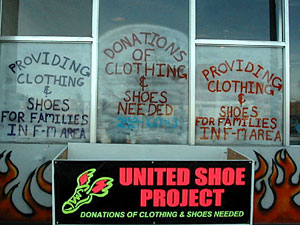 
Contributions for the United Shoe Project are dropped off  in front of the store and at bins at local K-Marts. (MPR Photo/Bob Reha)