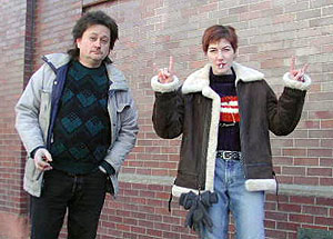 
Paul Deal and Erin Mahnke had a smoke on the sidewalk outside the telemarketing company they work for. Mahnke says she doesn't want to smoke out in the cold, but she has to because she can't quit. (MPR Photo/Chris Julin)