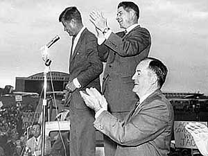 
John F. Kennedy, along with Freeman and Humphrey, made a stop at an airport in Minnesota in 1960. Freeman supported Kennedy's bid for president, even though many Lutheran churches in the state opposed Kennedy, a Catholic. (Photographer: Duff Johnston -- courtesy of Minnesota Historical Society)