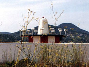 
The VOR  radiates a signal in 360 radials, one for each degree on the compass. The VHF carrier signal transmits a Morse code station identifier along with its navigational components. By tuning in a specific "radial," a pilot can tell exactly which way to fly to reach the airport. (MPR Photo/Bob Collins)