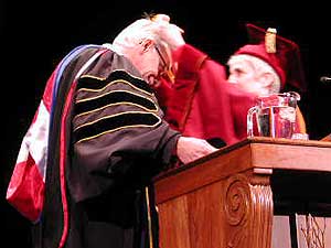 
Regents chair Maureen Reed presents Bruininks the presidential medallion, which is hand-tooled and cast in sterling silver. Bruininks' name and inauguration date are engraved on it.  (MPR Photo/Marisa Helms)