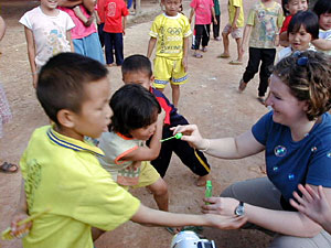 
Kate Liden brought stackable bubbles to play with the kids in a local Hmong village while cindy Xiong talked to relatives. (Photo courtesy of Gunnar Lars Liden)