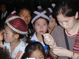 
 This picture is of me and some girls dressed up
in traditional Hmong clothes.  This was in Luang
Prabang, Laos.  They were having a New Year
celebration. 
 (Photo courtesy of Soua Yang)