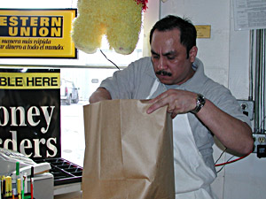 
Abraira is hardly afraid of the long hours of the small businessman. "Everything is hard, but not impossible," he said. "Always you have to make your dreams come true...nothing is easy, (and) you have to pay the price, make a big effort." (MPR Photo/Jeff Horwich)