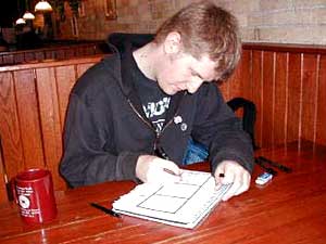 
Most of the time Mitch Clem draws his online cartoon "Nothing Nice to Say" in a downtown St. Cloud coffee shop.  Once he's done, he'll upload the comic to his Web site.  (MPR Photo/Tim Post)