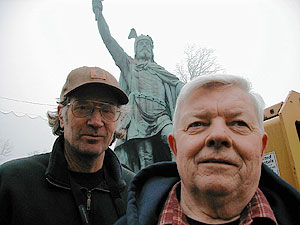 
Sculptor David Hyduke (left) and metal expert Arnie Lillo.
The two are conducting a detailed examination of the statue
to find out what sort of repairs are needed. (MPR Photo/Mark Steil)
