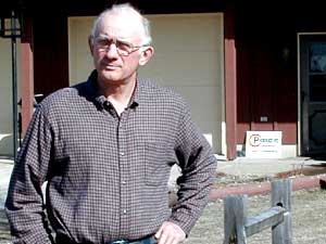 
Evan Schmeling opposes a plan to add a 2,000 cow dairy to his rural neighborhood.  Schmeling, a crop farmer, contacted the Land Stewardship Project for help.  He's now a member. (MPR Photo/Erin Galbally)