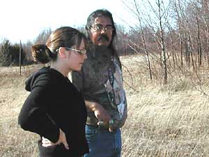
Bob Miller shows his daughter her great grandmother's homesite in a long gone Ojibway village on Wisconsin Point. (MPR Photo/Bob Kelleher)