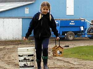 
Margaret, 8, says she can't imagine living in town. "Sometimes in town you don't get so many adventures, but out here you can see different animals and more of the things that can happen in life," she says. (MPR Photo/Nikki Tundel)