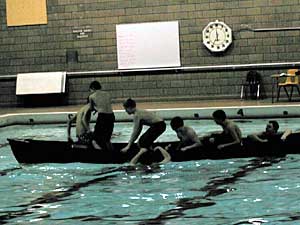 
Duluth middle schoolers are given fun activities, in the hopes they'll find one they'll stick with for life.  An overturned canoe gives these boys a chance to enjoy exercise. (MPR Photo/Bob Kelleher)