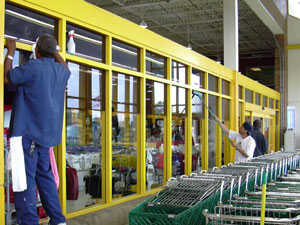 
Employees wash windows at the Rainbow Foods store in Apple Valley. (MPR Photo/Bill Catlin)