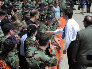 
Gov. Tim Pawlenty shook hands with members of the military, who waited for about a half hour in the warm sun to see President George W. Bush.    The president departed without greeting the crowd.

 (MPR Photo/Elizabeth Stawicki)