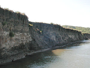 
The Missouri River is always reworking its channel.  These shoreline banks will eventually erode into the river. (MPR Photo/Mark Steil)