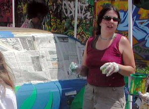 
Amy Greilig says she only decided to paint a Mississippi River scene the night before she began applying the paint. "You can think about it as much as you want, but you really don't know what it's going to look like until you start putting bright blue paint on your car." (MPR Photo/Euan Kerr)