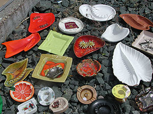 
Elftman says she has been collecting the ashtrays at garage sales and junkshops. She also has a few of her own from her smoking days. She is making the ashtray car to celebrate 10 years off cigarettes. She is going to fill each ashtray with clear resin so people can't stub out cigarettes. (MPR photo/Euan Kerr)