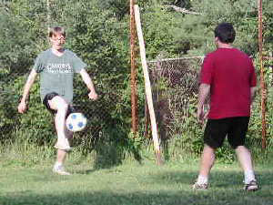 
Andy Olson, with the ball, is the Commissioner of the Commie Sporting League in Duluth, and he's played some soccer over the years. Adam Ritscher is less experienced, but Olson says he makes up for it with sheer determination. (MPR Photo/Chris Julin)
