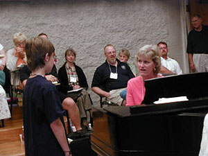 
Choral teacher Kathi Bernhard says since she's worked with St. John's VoiceCare Network and John Cooksey, she's learned how to deal with boys' changing voices.  (MPR Photo/Tim Post)