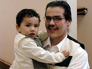 
The baptism was difficult for Jaylin Kelly's grandfather, Vince Olson, to watch. Olson follows traditional spiritual ways. (MPR Photo/Tom Robertson)