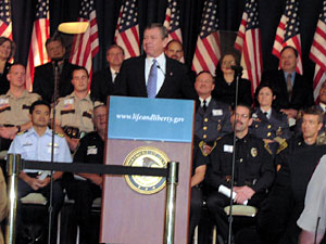 
 Ashcroft spoke to reporters and law enforcement officials from
throughout the state as part of a tour intended to drum up support
for the act. (MPR Photo/Elizabeth Stawicki)