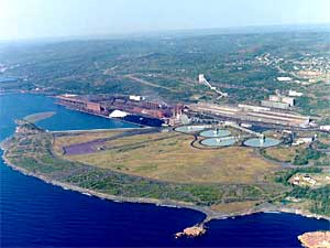 
Today, Northshore Mining Co. operates the former Reserve processing plant at Silver Bay.  The delta was formed over 25 years, while Reserve dumped waste rock at the edge of Lake Superior. The four clarifying ponds are part of today's waste treatment process. (Photo courtesy Cleveland-Cliffs)
