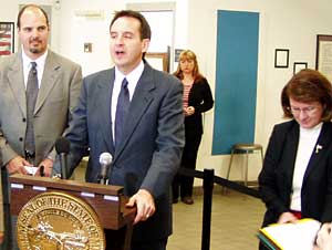 
Gov. Pawlenty announces his latest education proposal, to take away drivers licenses of high school students who skip too much school. He is joined by Public Safety Commissioner Rich Stanek, far left, and Education Commissioner Cheri Pierson Yecke, right. (MPR Photo/Tim Pugmire)