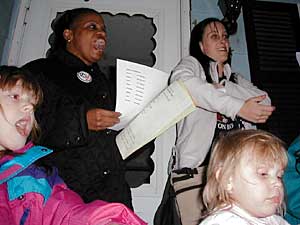 
Denise Brantley, upper left, was surrounded by supporters the night she took back her house.  (MPR Photo/Dan Olson)