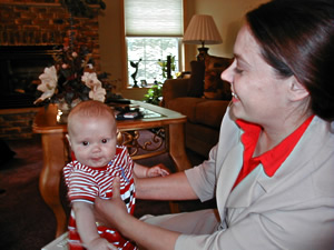 
Robbin Potter gave birth to her son, Jory, in May 2003, four months after her husband left for Iraq. Potter says if her husband stays in Iraq as long as Guard officials say he might, her son won't meet his father until he's one-year old.  (MPR file photo)