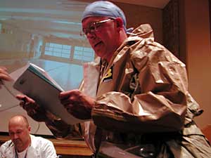 
This character dons a biohazard suit and starts spraying the emergency room with bleach in a misguided attempt to kill the smallpox bacteria. (MPR Photo/Annie Baxter)