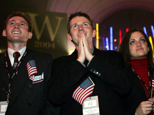 
Supporters of  President George W. Bush look up at results on a giant screen at the Republican National Committee election night party in Washington as the state of Ohio appears to be won by Bush.
 (TIM SLOAN/AFP/Getty Images)