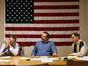 
Shambroom juxtaposes his photos of nuclear weapons with the more mundane evidence of democratic power -- local government meetings. This is a meeting of the city council in Lewiston, Minnesota (population 1,405), March 10, 1999.
 (Photo courtesy of Paul Shambroom)
