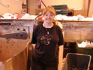 
Tracy Westman sorts recycling materials in one of West Central Industries' sheltered workshops. (MPR Photo/Annie Baxter)