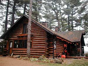 
Doug Wood lives in this restored log cabin along the Mississippi River north of St. Cloud. (MPR Photo/Tim Post)