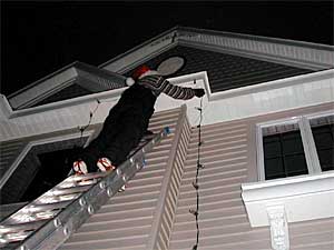 
Rob Schlosser says most of his customers are older people who don't like to put up Christmas lights in the winter months.  But Schlosser says he's seeing more customers of a younger age, who just don't want to deal with the hassle and the danger of installing lights.   (MPR Photo/Tim Post)