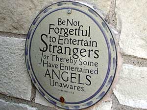 
This plaque, which hangs on an exterior wall, greets visitors to Clare House. (MPR Photo/Greta Cunningham)