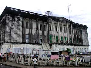 
The Masonic temple in Monrovia now houses several thousand refugees from the Liberian countryside. (MPR Photo/Nyeba Manston-Dunbar)
