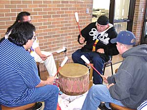 
Gov. Pawlenty was greeted by a group of drummers from Pine Point on the White Earth Reservation. The governor also ate Indian tacos and wild rice, and participated in a pipe ceremony.  (MPR photo/Tom Robertson)
