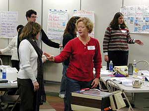 
teachers in an Envoy workshop learn how gestures can help control behavior in the classroom (MPR photo/Jim Bickal)
