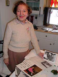 
Pianist Beatrice Ohanessian stands surrounded by the souvenirs of a remarkable career. Her hand rests on a photo taken of her with then Ambassador Jacques Chirac. (MPR Photo/Marianne Combs)