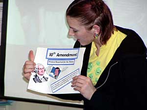 
Senior Hannah Hayward is holding up handmade illustrations for her presentation on the Bill of Rights.
 (Brandt Williams)
