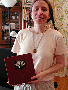 
Mail artist Roz Stendahl designs her own rubber stamps from drawings. She uses the stamps in mail art and other forms of collage and book art. Many of her rubber stamps feature her dogs. View a slideshow of her work by clicking the link. (MPR Photo/Marianne Combs)