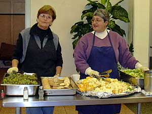 
Volunteers at the Damiano Center in Duluth work alongside paid staffers to serve a hot meal to about 200 people every day.
 (MPR Photo/Stephanie Hemphill)